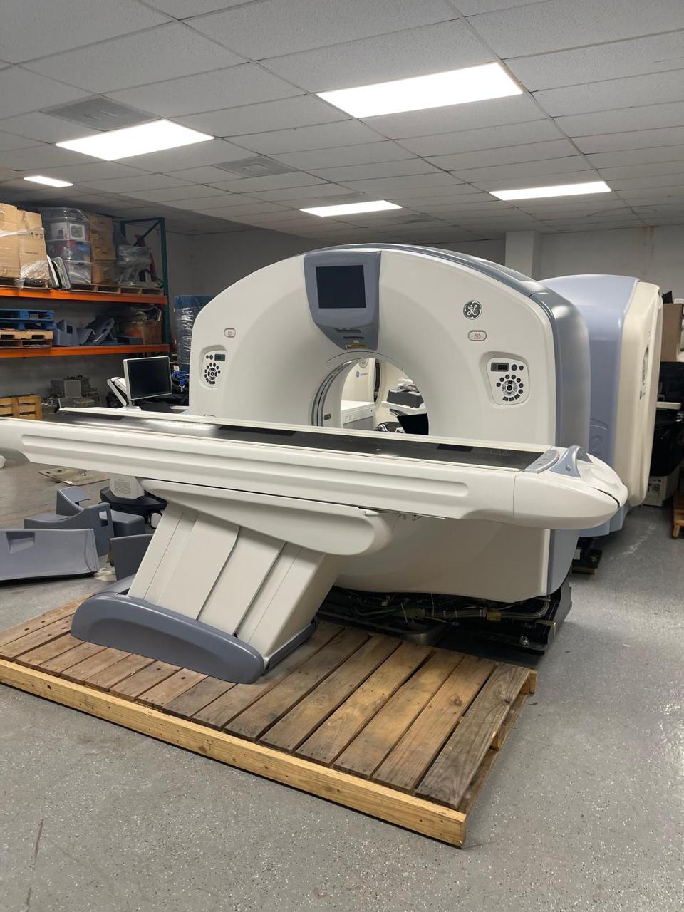 Refurbished CT scanner staged for buyer evaluation questions.