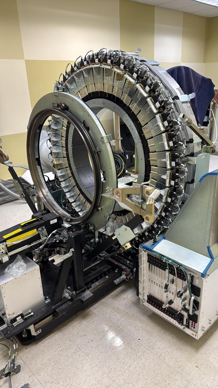 Medical imaging equipment gantry opened for parts sourcing and service support.